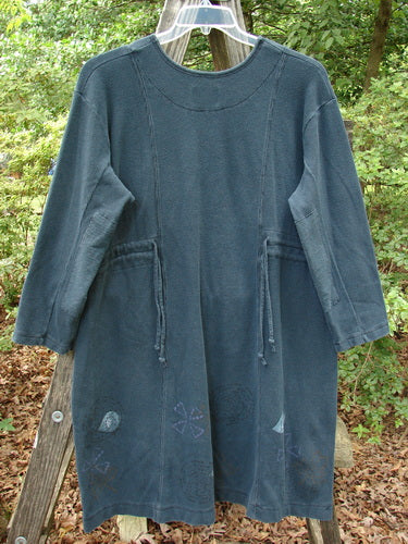 1999 Thermal Home Dress Paisley Peacock Size 0 displayed on a clothes rack, showcasing its squared neckline, rectangle elbow patches, and unique sectional panels.