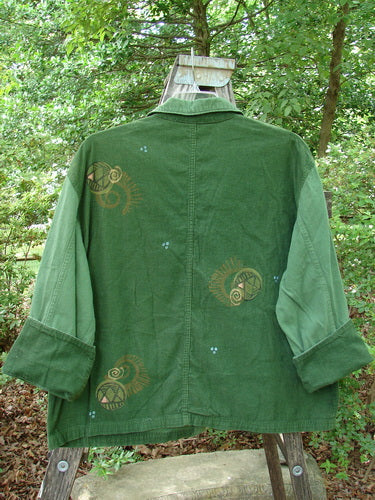 1997 Mason's Jacket Structural Verdigris OSFA: A green jacket with an intricate design, featuring a folded neckline, painted pockets, cuffed cord sleeves, metal buttons, and riveted pocket edges.