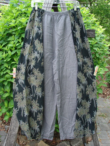 Barclay Linen Pucker Accent 4 Square Pant Tropical Black Grey Size 0, featuring a loose fit with a palm-tree motif on wide side panels and smooth gray center panels, hanging outdoors.
