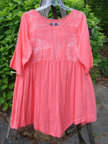 Barclay Linen Two Pocket Dolly Dress Notes Coral Size 0, features a flared silhouette with elbow-length sleeves, gathered waist seam, subtle pattern, and dual drop pockets, hanging outdoors against greenery.