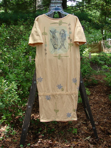 Alt text: 1990 B Base Dress Double Fish Marigold Altered OSFA with fish and flower designs on a rack.