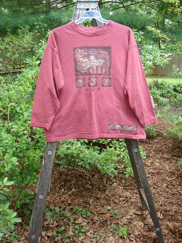 1995 Long Sleeved Tee Vintage Train Hollyberry Size 1 displayed on a wooden stand, showcasing its ribbed neckline, drop shoulders, hem paint accent, and superior vintage train theme paint.