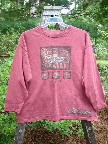 1995 Long Sleeved Tee Vintage Train Hollyberry Size 1 displayed on a hanger, showcasing its thicker ribbed neckline, drop shoulders, hem paint accent, and superior vintage train theme paint detailing.
