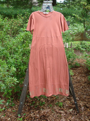 1998 Croquette Dress Games Rover Altered Size 1 displayed on a clothes rack, featuring a shallow rolled neckline, vertical rounded panels, slight empire waist, and a sweeping A-line shape.