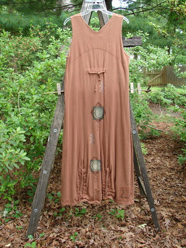 1998 Arcadia Jumper Harvest Moon Rockwood Altered Size 1 displayed on a wooden ladder, showcasing a double-paneled bodice, rectangular insert, and vertical hem drawcords, with a full-length, sectional bottom swing.