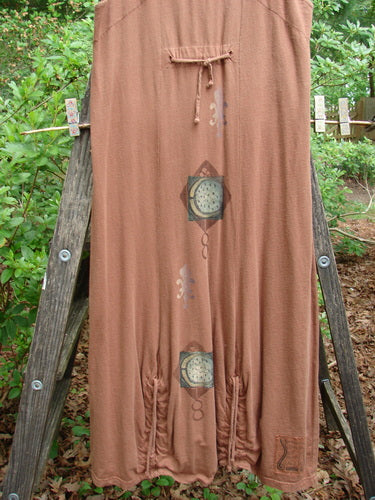 1998 Arcadia Jumper Harvest Moon Rockwood Altered Size 1 displayed draped over a wooden ladder, showcasing its intricate bodice design and vertical hem drawcords, emphasizing its vintage style and perfect condition.