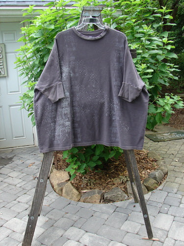 Barclay Fleece Banded Sleeve Dolman Top Diamond Star Dark Stone OSFA displayed on a clothing rack, showcasing its wide, boxy shape, banded lower sleeves, and diamond star pattern.