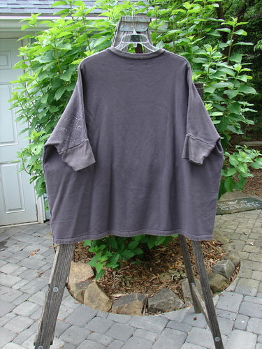 Barclay Fleece Banded Sleeve Dolman Top Diamond Star Dark Stone OSFA displayed on a clothes rack, showcasing its wide boxy shape, rounded neckline, and banded hemline with diamond star patterns.