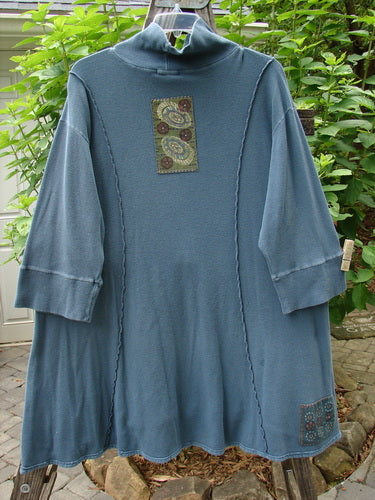 Barclay Patched Thermal Quad Drop Pocket Tunic Dress Blue Tealen Size 2 featuring a patchwork design, double-layered turtleneck, widening hem, four drop pockets, and whimsical exterior stitch details.