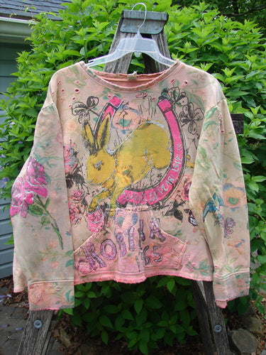 Magnolia Pearl Lucky Anna Marais Glitter Sweatshirt features a hand-painted design with a yellow rabbit, floral motifs, and ROLLA '65 on plush cotton fleece, showcasing vintage elegance from Bluefishfinder.com.