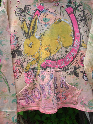 Magnolia Pearl Fleece Lucky Anna Glitter Sweatshirt Marais OSFA features a pastel, tie-dyed design with floral print, distressed edges, a large yellow rabbit in a pink horseshoe, and vintage-inspired graphics.