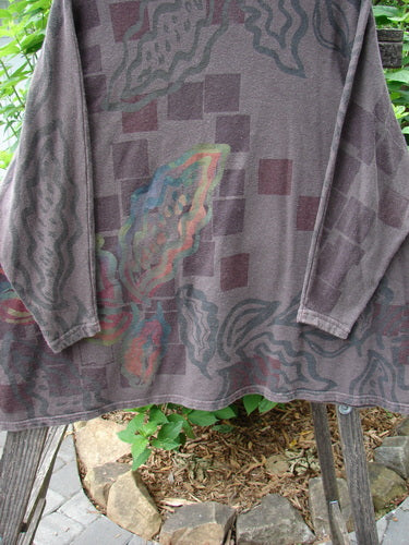 Barclay Cotton Hemp Dolman Sleeve Pullover Top Abstract Continuum Stone OSFA on a metal rod, showcasing a wide boxy shape, dolman sleeves, and abstract patterns.