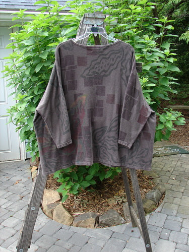 Barclay Cotton Hemp Dolman Sleeve Pullover Top Abstract Continuum Stone OSFA displayed on a clothes rack, highlighting its generous wide boxy shape, dolman sleeves, and abstract theme pattern.