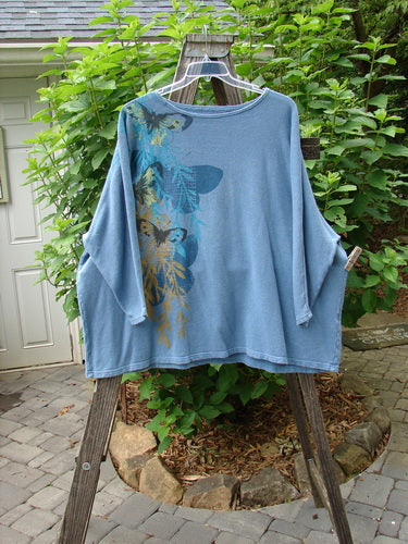 Barclay Cotton Hemp Dolman Sleeve Pullover Top Butterfly Blue Dusk OSFA displayed hanging, showcasing its wide boxy shape, dolman sleeves, and butterfly design.