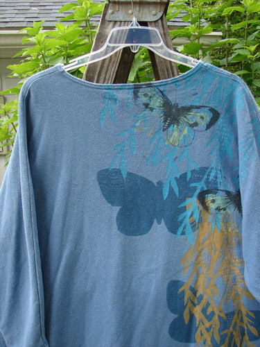 Barclay Cotton Hemp Dolman Sleeve Pullover Top Butterfly Blue Dusk OSFA features a boxy shape, rounded neckline, dolman sleeves, and butterfly patterns on a cozy blue fabric.