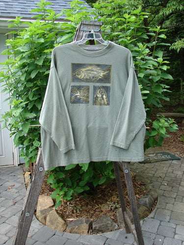 1996 Long Sleeved Tee Triple Fish Cricket Size 2 on a clothes rack, featuring drop shoulders, thicker ribbed neckline, and a vintage triple fish theme paint, in perfect condition.