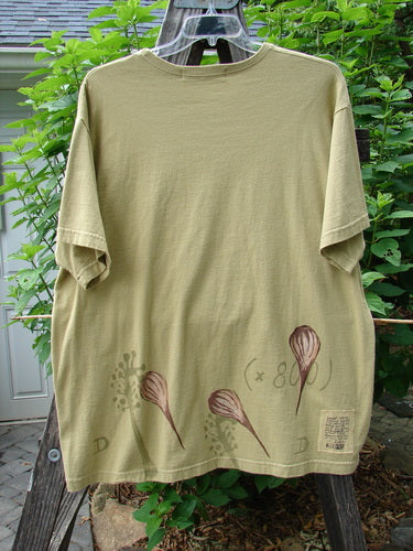 1998 Botanicals Short Sleeved Tee Floral Bud Seed Size 2, featuring a superior floral bud design, boxy shape, and softly ribbed neckline, made from organic cotton with signature Blue Fish patch.