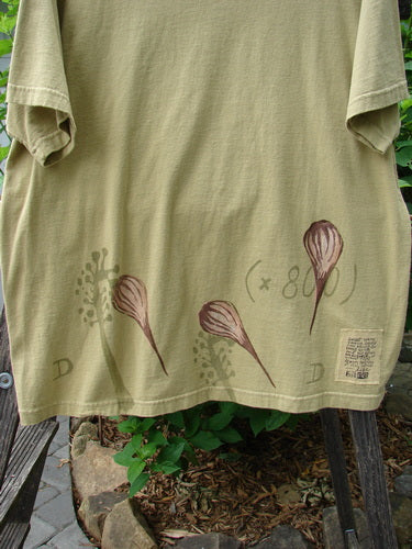 1998 Botanicals Short Sleeved Tee Floral Bud Seed Size 2, featuring a longer boxy shape with floral bud design, ribbed neckline, and Blue Fish patch, made from organic cotton.