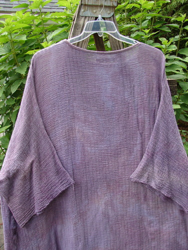 Barclay Gauze Ana Tunic Dress Unpainted Mottled Lavender Rain OSFA displayed on a hanger, showcasing its wide three-quarter sleeves, seamless shoulders, and varying hemline.