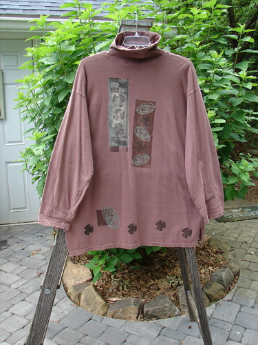 1994 Long Sleeved Turtleneck Top Double Wind Rosewood Size 2 displayed on a wooden stand, showcasing its looser flop turtleneck, drop shoulders, and vented sides.