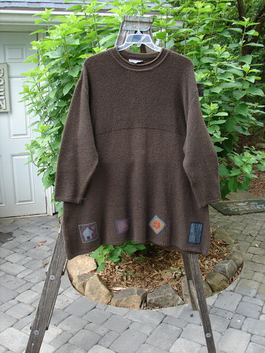 Barclay Patched Favorite Rollneck Alpaca Cotton Tunic Sweater Treeba OSFA displayed on a wooden rack, showcasing its substantial knit and ribbed mock turtleneck.