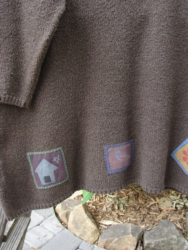 Barclay Patched Favorite Rollneck Alpaca Cotton Tunic Sweater Treeba OSFA, featuring patchwork designs and a thick knit, close-up of a patch with a house and star, showcasing detailed craftsmanship.