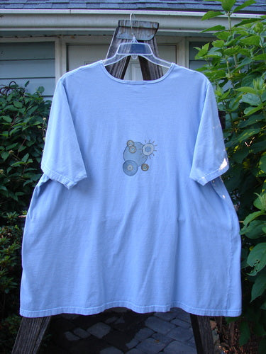 Barclay Short Sleeved A Line Tee Circle Pebble Sky Size 2, displayed on a hanger, showcasing its wide boat neckline, short sleeves, and centered circle pebble theme paint design.