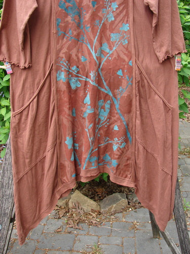 Barclay Wildflower Tunic Floral Sprig Harvest Size 0, featuring open-front design with bohemian teal-blue botanical motifs, long sleeves, uneven hemline, and patch pockets, exemplifying Bluefishfinder.com's vintage-inspired creativity.