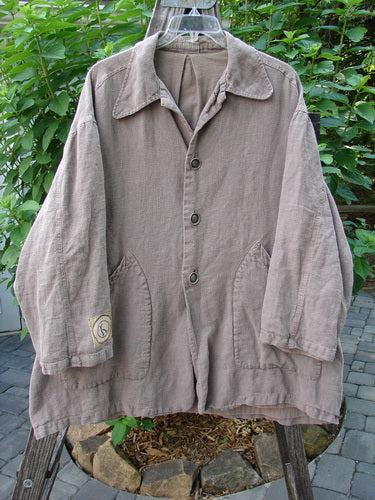 Alt text: 1999 PMU Single Patch Hemp Yard Coat Shale Size 2 displayed on a hanger, showcasing its heavy-weight cotton hemp outer, super soft flannel lining, and thick metal buttons down the front.