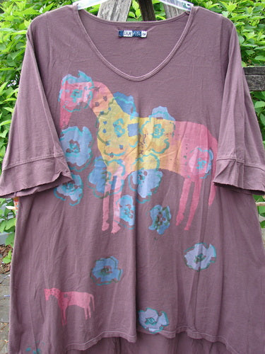 Barclay Three Quarter Sleeved Happiness Tunic Primitive Pony Fig Size 0 features elbow-length ruffled sleeves, screen-printed horse silhouettes, and a drawcord back, hanging outdoors on a plastic hanger.