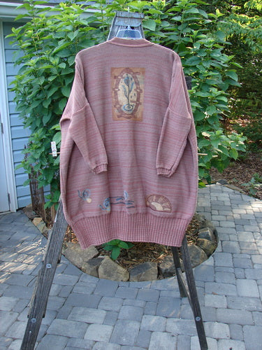 1995 Fireside Cardigan Sweater Single Sprig Marled Brick OSFA displayed on a rack, showcasing its deep neckline, oversized pockets, metal buttons, and ribbed hem, highlighting its unique vintage design.