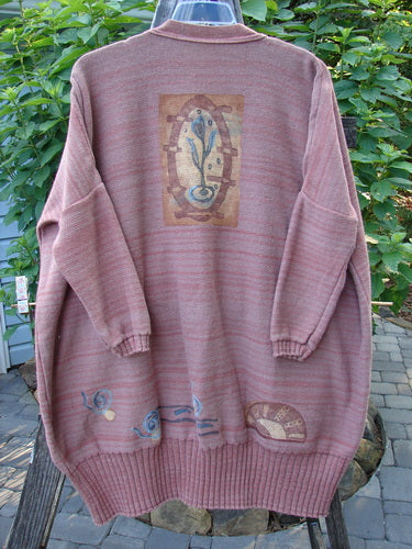 1995 Fireside Cardigan Sweater Single Sprig Marled Brick OSFA: Long-sleeved, deep neckline, flared hips, metal buttons, drop shoulders, and ribbed hem, displayed on a hanger.