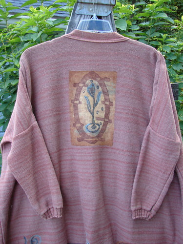 Alt text: 1995 Fireside Cardigan Sweater Single Sprig Marled Brick OSFA featuring a flower detail, deep neckline, ribbed oversized pockets, metal buttons, and drop shoulders.