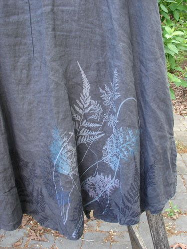 Barclay Linen Tie Pocket Cardigan Field Fern Black Size 0 showcasing a mid-length hem with pale blue and off-white fern-leaf print, made from textured natural-fiber fabric, hanging outdoors.