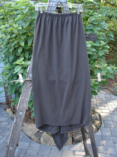 1994 Harvest Gather Skirt Unpainted Bark Size 1 displayed on a wooden rack, showcasing its unique sectional panels and full elastic waistband.
