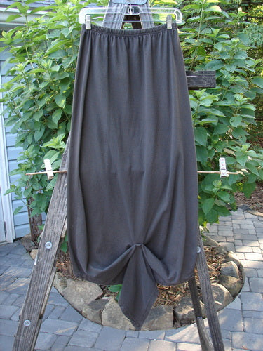 Alt text:  1994 Harvest Gather Skirt Unpainted Bark Size 1 displayed on a wooden ladder, showcasing sectional panels and a 1-inch replaced elastic waistband.