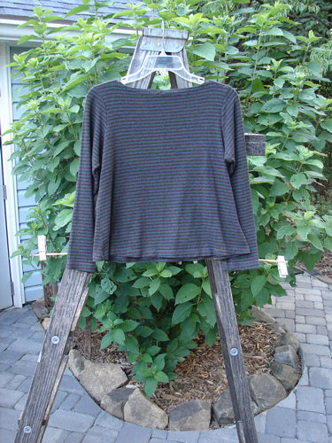 2000 Rayon Lycra Rib Long Sleeved Layering Top Unpainted Burgundy Stripe Size 1 displayed on a wooden rack, showcasing its rounded neckline, longer sleeves, slight crop length, and A-line shape.