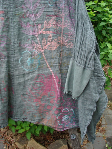 Barclay Crinkle Linen Open Front Rib Sleeve Cheerful Cardigan Scripted Fern Caper Size 0 displayed outdoors, showcasing its dolman sleeves, ribbed cuffs, and delicate botanical motifs on featherweight crinkle linen.
