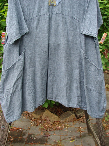 Barclay NWT Linen Cross Over Urchin Dress Unpainted Stripe Sky Size 1, featuring a relaxed fit with a crossover V-neckline, short sleeves, large front pockets, and a textured linen fabric hanging outdoors.