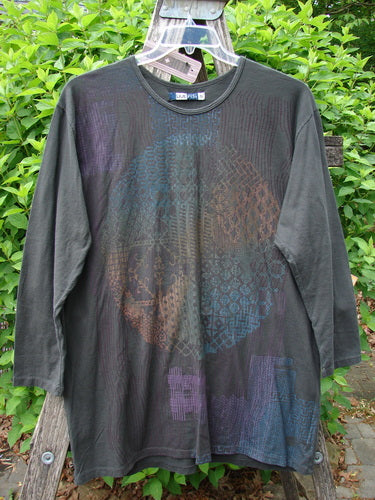 Barclay NWT Long Sleeved Studio Tee Celtic Medallion Smoke Size 0 features a multicolored geometric print on dark fabric, hanging on a ladder, showcasing its cozy sleeves and rounded neckline.