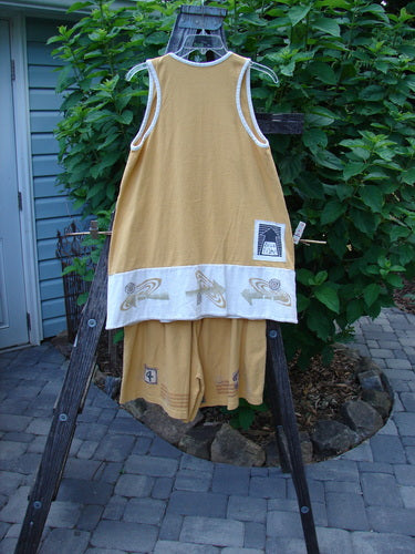 1998 8 Ball Tunic Parcheesi Short Duo Lemonade Size 0 displayed on a rack and wooden stand, featuring a scoop neckline, contrasting edges, and classic Blue Fish Games theme details.