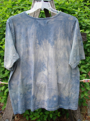 Daisy Hagey Barclay Fiona Straight Tee Tree Mottled Window Pane Size 0 in blue-gray tie-dye cotton, shown hanging on a clear hanger against green foliage.