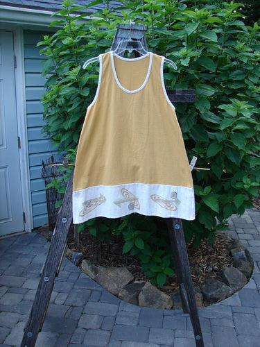 1998 8 Ball Tunic Parcheesi Short Duo Lemonade Size 0 displayed on a wooden rack, showcasing its A-line shape, scoop neckline, and racerback shoulder line with matching wide-leg shorts.