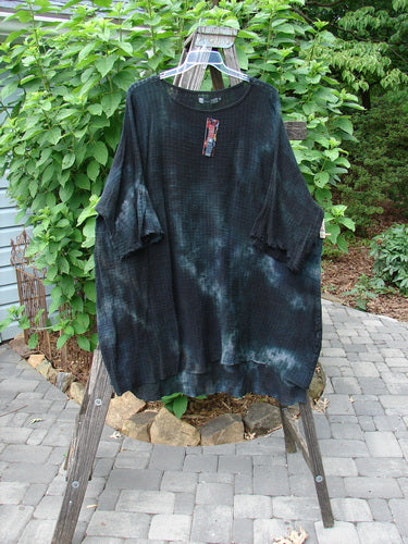 Barclay NWT Gauze Ana Tunic Dress Unpainted Mottled Minuit OSFA displayed on a swinger, showcasing its wide three-quarter sleeves, rounded neckline, and varying hemline.