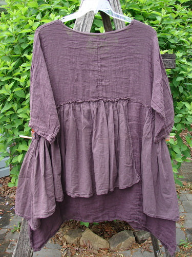 Barclay Gauze Batiste Petal Urchin Flounce Dress Unpainted Fig Size 1, featuring voluminous sleeves, empire waist, and flowing hemline, elegantly displayed against a natural backdrop, embodying Bluefishfinder.com's vintage-inspired style.