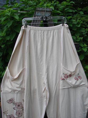 Barclay Exterior Stitch Plane Pant Cherry Blossom Natural Dew Size 2 on a rack, showcasing full-length exterior vertical seams, wide lowers, deep rise, and double front drop pockets.