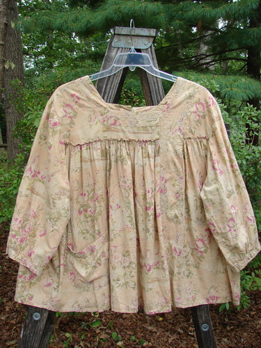 Magnolia Pearl Embroidered Light Weight Cotton Prairie Pocket Top Vintage Rose OSFA displayed on a hanger, featuring a square neckline, vertical panel, curly fabric accent, dual rear button line, and flowing A-line shape.