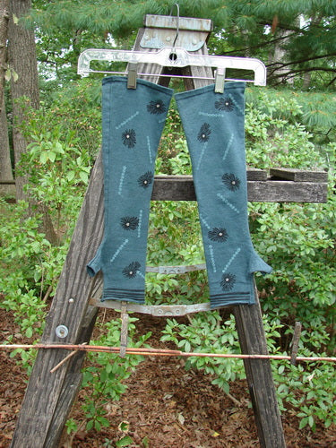 Barclay Cotton Lycra Hemp Fingerless Glove Polka Flower Blue Grey OSFA displayed on a wooden rack, showcasing its polka flower pattern and unique four-finger opening with thumb tunnel design.