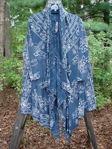 Magnolia Pearl Cotton Jersey Kareas Cardigan Jacket Navy Ranch Hand OSFA displayed on a wooden stand, featuring a knotted hemline, open front, deep pockets, and continuous bandana print.