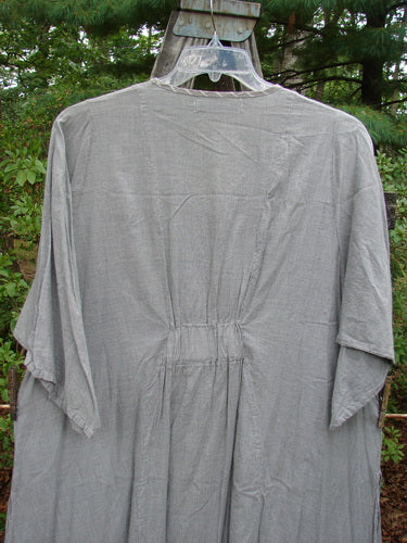 Barclay Light Weight Cotton High Vent Curve Dress with Tulip Grey Black Stripe Size 2 displayed on a hanger against an outdoor backdrop, highlighting its V neckline, side vents, and A-line shape.